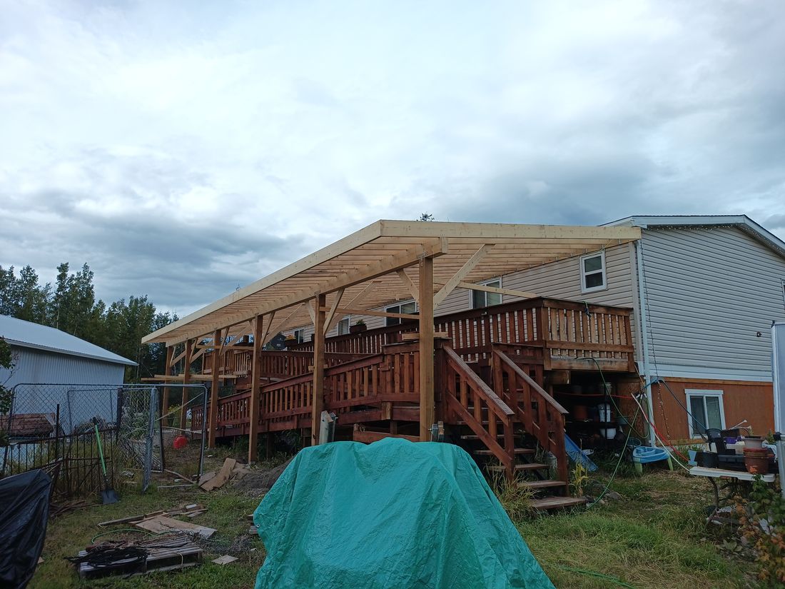 A large deck cover framed over an existing deck