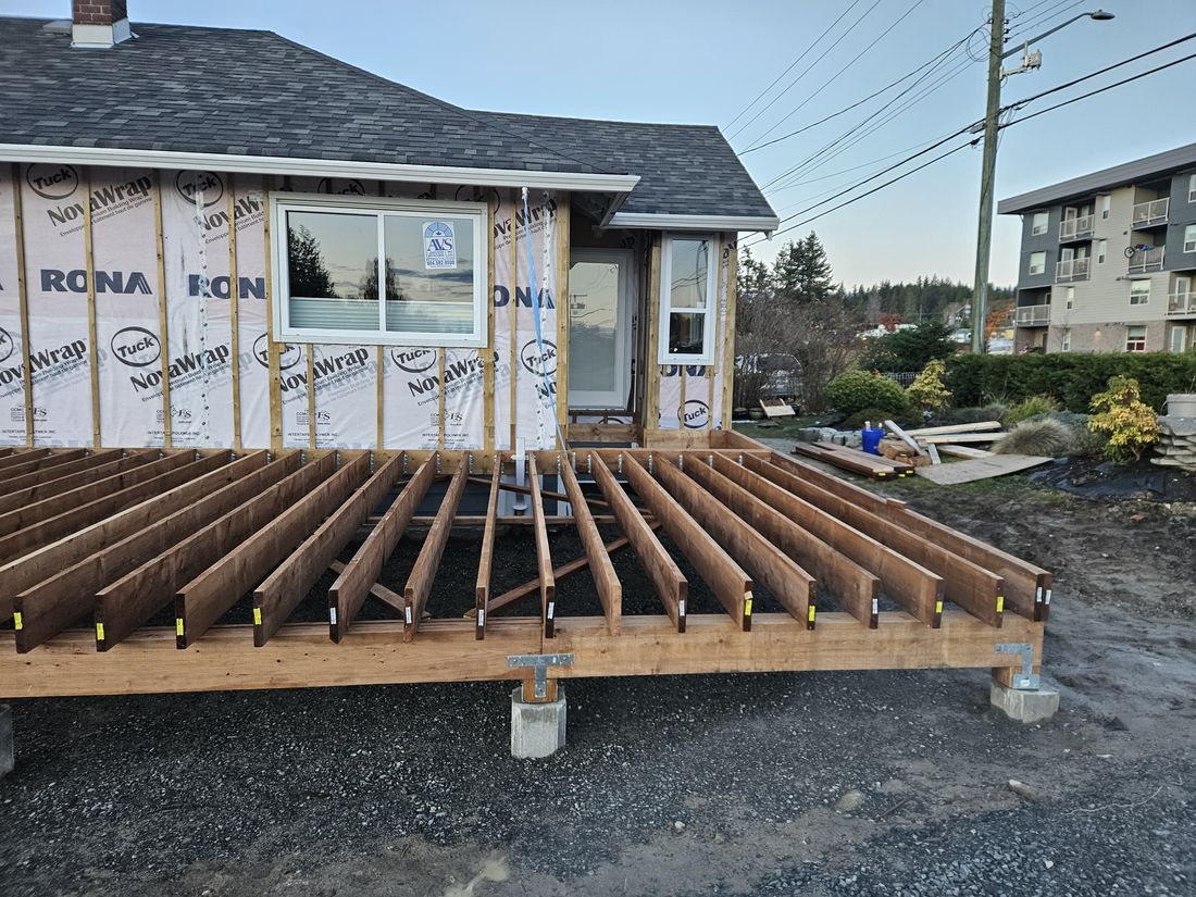 Deck framing on footings with galvanized post bases