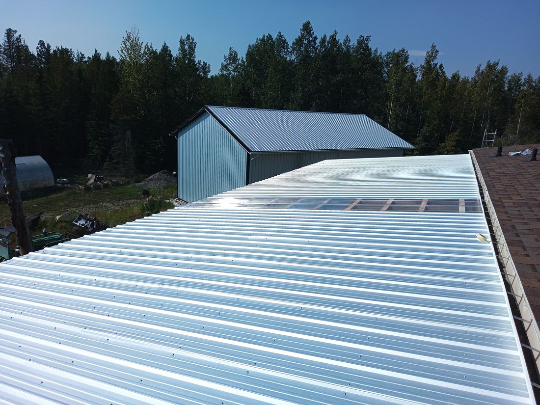 A Galvalume deck cover seen from the adjacent roof