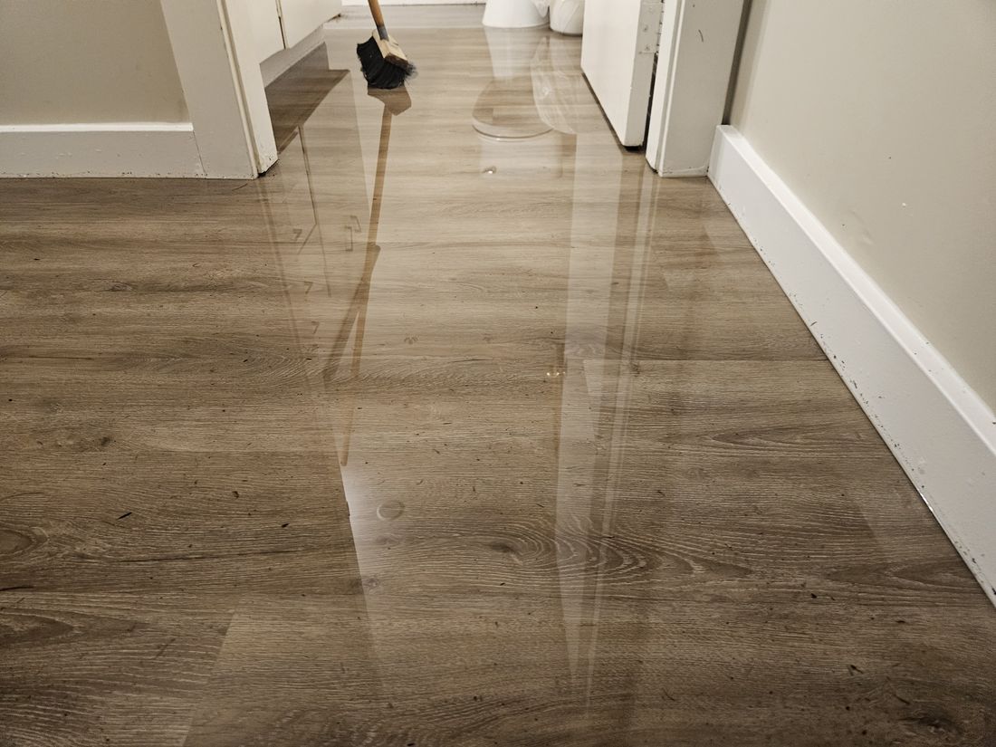 Flood water across a hallway floor