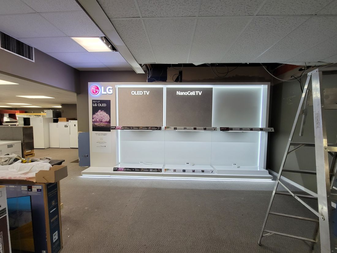 A television display build in progress with the ceiling open