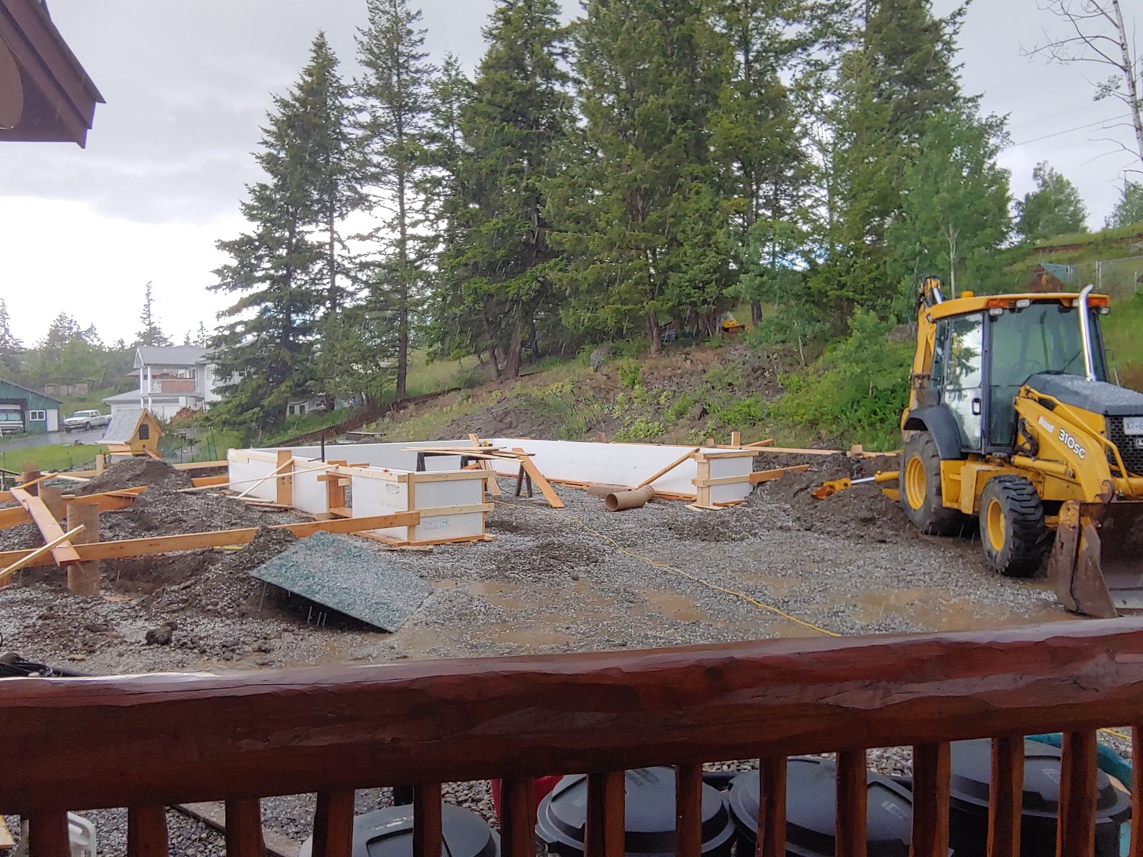 Insulated concrete forms and sonotube footings set for a log shop